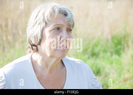 Portrait of a worried old age woman Stock Photo