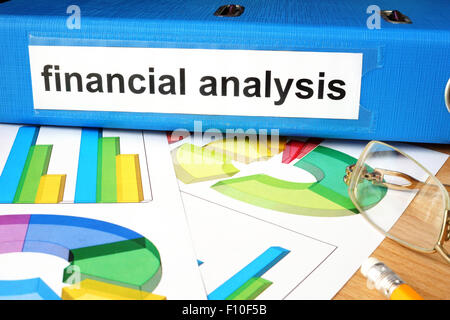 Folder with label financial analysis and charts. Stock Photo