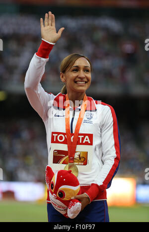 Beijing, China. 24th Aug, 2015. Britain's Jessica Ennis-Hill celebrates on the podium after winning the gold medal in the women's Heptathlon event during the Beijing 2015 IAAF World Championships at the National Stadium, also known as Bird's Nest, in Beijing, China, 24 August 2015. Credit:  dpa picture alliance/Alamy Live News Stock Photo