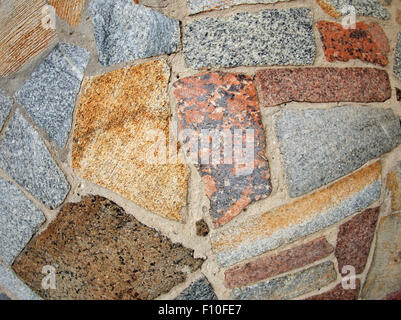 Detail of a wall of the large colored marble blocks are not geometric shapes Stock Photo