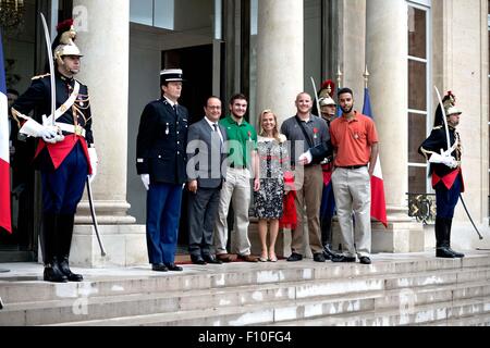 Paris, France. 24th Aug, 2015. (From 3-L to 7-L) French President Francois Hollande poses a photo with Alek Skarlatos, U.S. Ambassador to France Jane D. Hartley, Spencer Stone and Anthony Sadler at the Elysee Palace in Paris, France, Aug. 24, 2015. French President Francois Hollande on Monday awarded France's highest honor, the Legion d'honneur, to three U.S. men and Briton Chris Norman who helped neutralize a shooter at Thalys high-speed train between Amsterdam and Paris last week. Credit:  Andy Louis/Xinhua/Alamy Live News