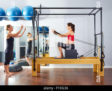 Pilates reformer woman short box swan exercise Stock Photo by