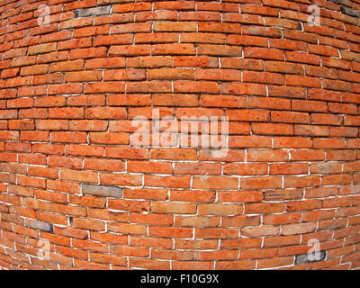 Fragment of old and red brick wall with wide angle fisheye lens and distortion view Stock Photo