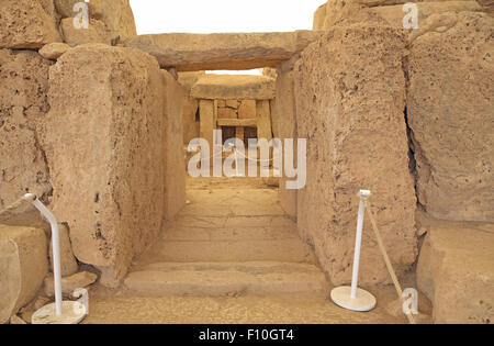 View through doorways to an altar-like structure,  Mnajdra Temples, near Qrendi, Malta. Stock Photo