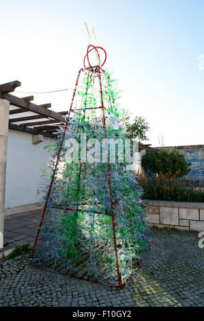 Lisbon, Portugal -December 28, 2013, Creative recycling  Christmas tree made from old plastic bottles Stock Photo