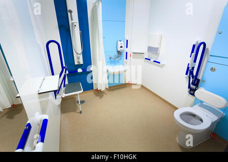 Disabled bathroom in hospital with assistance bars without people Stock Photo