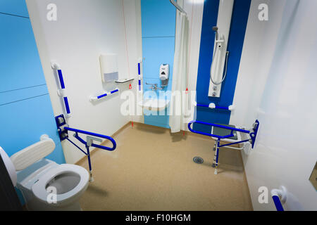 Disabled wetroom bathroom in hospital with assistance bars without people Stock Photo