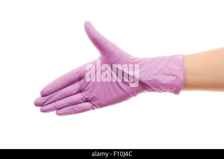 Close up of female doctor's hand in purple sterilized surgical glove giving for handshake against white background Stock Photo