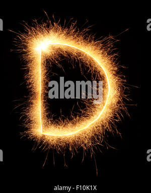 'D' letter drawn with bengali sparkles isolated on black background Stock Photo