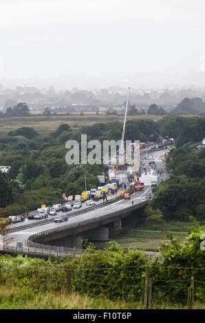 Shoreham-by-Sea, UK. 24th August 2015. The scenes on the A27 at Shoreham-by-Sea, West Sussex, where a Hawker Hunter jet crashed into vehicles and exploded during the Shoreham Air Show on Saturday 22nd August 2015. A crane has been brought to the site to remove the remains of the jet for further investigation. Police say up to 20 people may have died in the incident. The A27 is expected to remain closed until Wednesday. © Francesca Moore/Alamy Live News Credit:  Francesca Moore/Alamy Live News Stock Photo