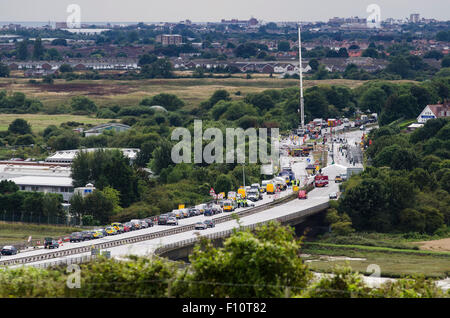 Shoreham-by-Sea, UK. 24th August 2015. The scenes on the A27 at Shoreham-by-Sea, West Sussex, where a Hawker Hunter jet crashed into vehicles and exploded during the Shoreham Air Show on Saturday 22nd August 2015. A crane has been brought to the site to remove the remains of the jet for further investigation. Police say up to 20 people may have died in the incident. The A27 is expected to remain closed until Wednesday. © Francesca Moore/Alamy Live News Credit:  Francesca Moore/Alamy Live News Stock Photo