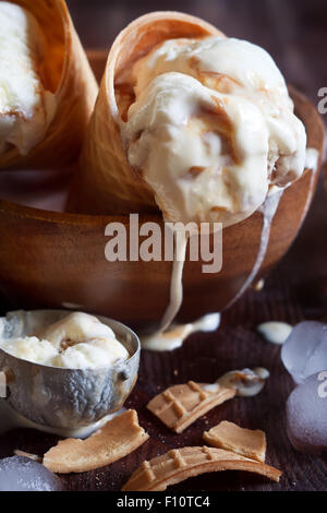 Homemade ice cream with salted caramel in waffle cones Stock Photo