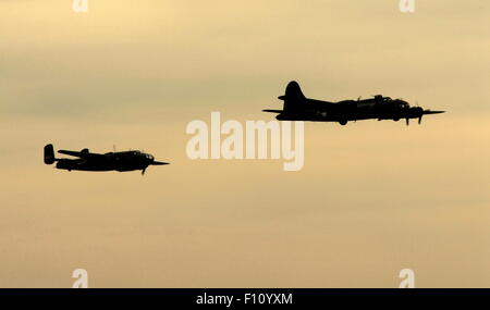 AJAXNETPHOTO. 2013. SHOREHAM, ENGLAND. - LAST OF THE B-17S - B-17 FLYING FORTRESS G-BEDF SALLY-B LEADS B-25 MEDIUM MITCHELL BOMBER OVER THE AIRFIELD IN FADING LIGHT.  PHOTO:JONATHAN EASTLAND/AJAX REF:D130109 539 Stock Photo