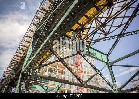 Development behind the Flushing Line elevated subway in the Long Island City neighborhood of New York seen on Saturday, August 22, 2015. A group of investors is proposing an even bigger mixed-use development of 128,000 square feet in the neighborhood which would include a pedestrian bridge connecting to Roosevelt Island, the future home of Cornell Tech.  (© Richard B. Levine) Stock Photo