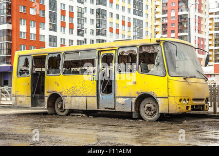 Old dirty yellow bus with broken windows Stock Photo