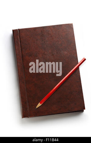 Dark blank notebook with red pencil on it Stock Photo