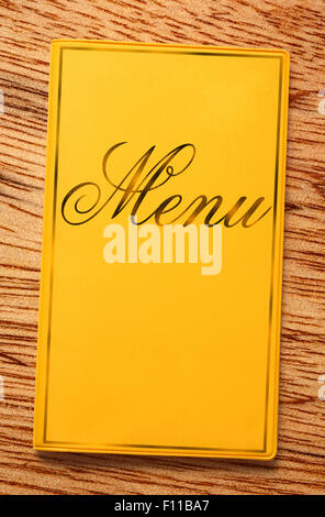 The yellow framed menu book in closeup Stock Photo