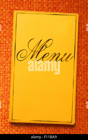 The yellow framed menu book in closeup Stock Photo