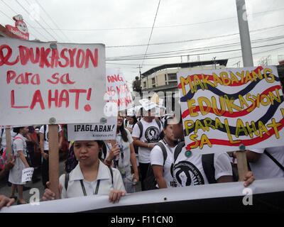 Filipino student activists hold placards bearing the messages, 'Education for all,' and, 'Patriotic Education for all,' during a rally at Mendiola bridge, near Malacanang Palace, in Manila, Philippines, as they assail the Philippine government's policies on education. Education activists assailed the governments policies on education, criticizing the removal of the Filipino subject from the country's general education curriculum; as well as the additional two years in basic education which they say will make Filipino workers available for cheap labor in other countries. (Photo by Richard James Stock Photo