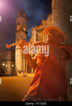 Hispanic musician playing violin on Havana street, Havana, Cuba Stock Photo