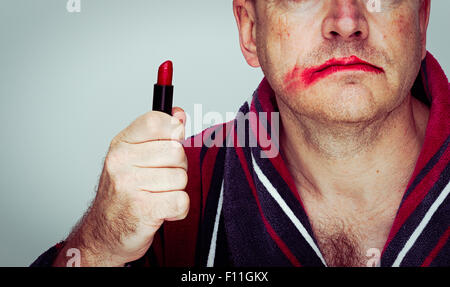 Caucasian man wearing smeared lipstick Stock Photo