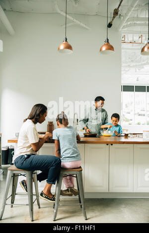 Family cooking in kitchen Stock Photo