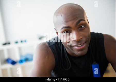 Black man resting in gym Stock Photo