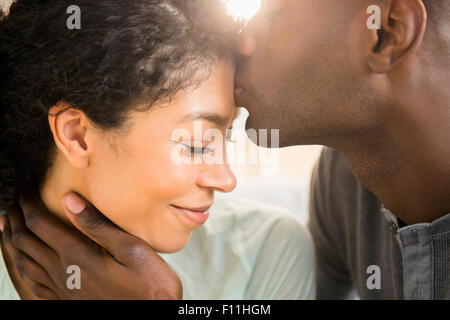 Close up of smiling couple kissing Stock Photo