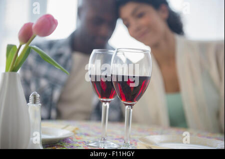 Couple with red wine in restaurant Stock Photo