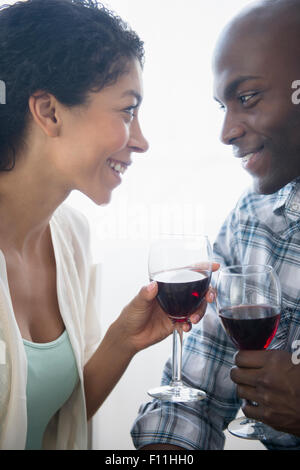 Couple drinking glasses of red wine Stock Photo