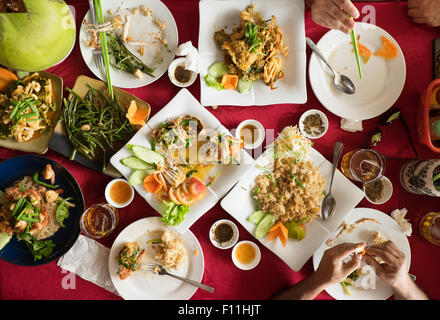 Overhead view of seafood and salad dishes on table Stock Photo
