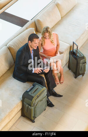 Overhead view of business people talking in lobby Stock Photo