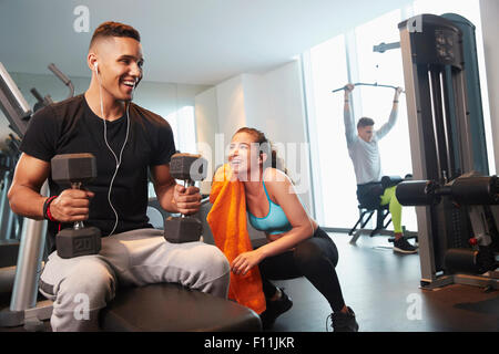 Friends working out in gym Stock Photo