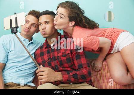 Friends making faces and taking selfie Stock Photo