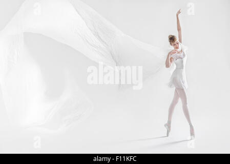 Caucasian ballet dancer dancing on pointe Stock Photo