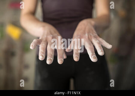 Close up of chalky hands of athlete in gym Stock Photo