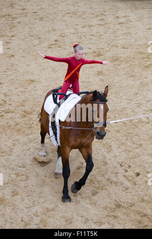 Girl vaulting bay Hanoverian mare Lower Saxony, Stock Photo