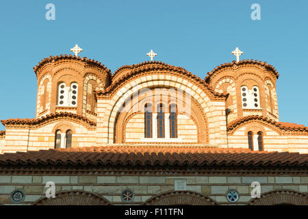 Top of a  monastery with the three crosses against the blue sky. Stock Photo