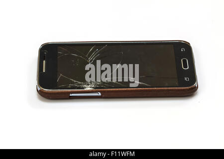 smartphone with broken screen on white background Stock Photo