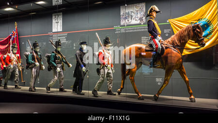 Battle dresses and weapons of Allied soldiers in the Memorial 1815 museum about the Battle of Waterloo, Braine-l'Alleud, Belgium Stock Photo