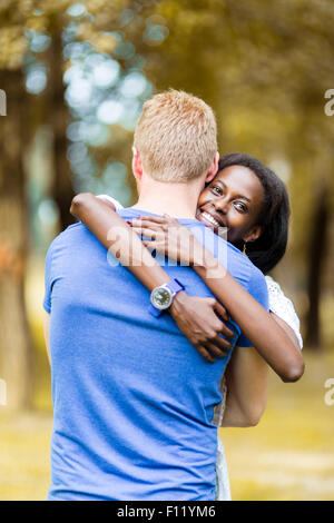 Couple in love hugging peacfully outdoors and being truly happy. Feeling of security and serenity Stock Photo