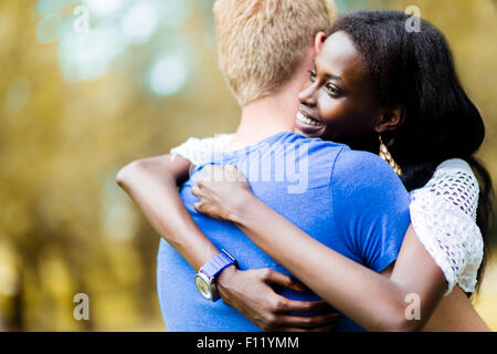 Couple in love hugging peacfully outdoors and being truly happy. Feeling of security and serenity Stock Photo