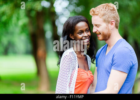 Couple in love hugging peacfully outdoors and being truly happy. Feeling of security and serenity Stock Photo