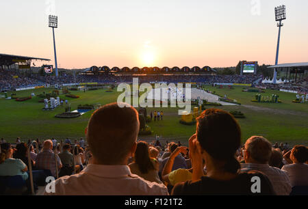 Aachen, Germany. 22nd Aug, 2015. Viewers watch a show jumping competition in the main stadium during the FEI European Championships in Aachen, Germany, 22 August 2015. Photo: Uwe Anspach/dpa/Alamy Live News Stock Photo