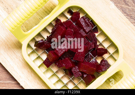 Cutting pieces of boiled beets top view Stock Photo