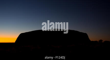 Majestic Uluru at sunrise on a clear winter's morning in the Northern Territory, Australia Stock Photo