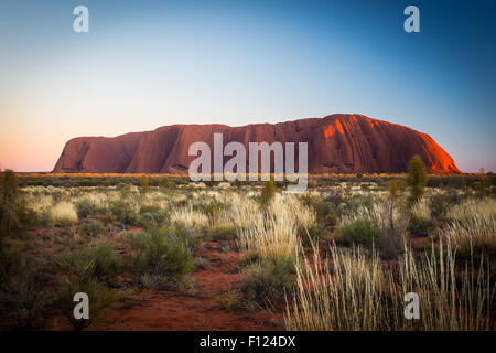 Majestic Uluru at sunrise on a clear winter's morning in the Northern Territory, Australia Stock Photo