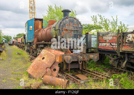 Rusty Steam with a crane on a carriage, in the scrap yard at Tanfield Railway, the oldest railway in the world. Stock Photo