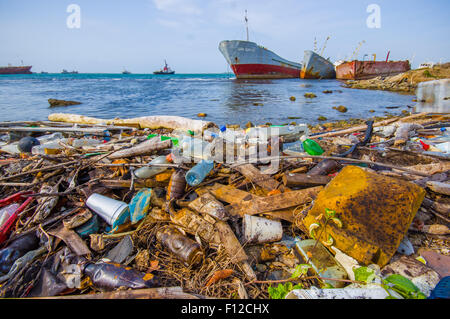 COLON, PANAMA - APRIL 15, 2015: Waste and pollution washing on the shores of the beach in city of Colon in Panama Stock Photo