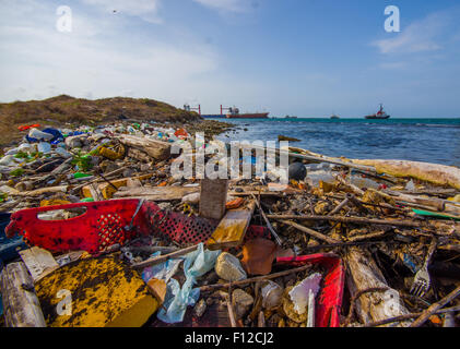 COLON, PANAMA - APRIL 15, 2015: Waste and pollution washing on the shores of the beach in city of Colon in Panama Stock Photo